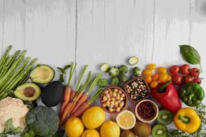 Hacer click en la imagen para ir a la sección del servicio de nutrición deportiva. Se muestran alimentos saludables vistos desde arriba.